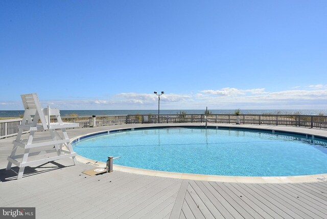 39281 Piney Dr Unit 55115, Bethany Beach, DE 19930 - community pool featuring a water view and fence