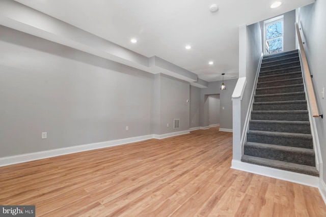 basement featuring light wood-type flooring