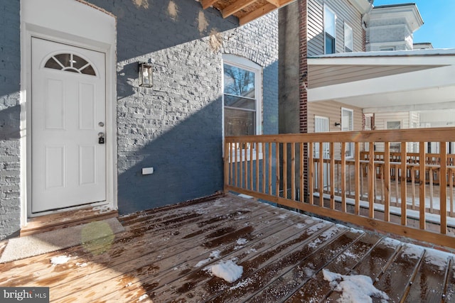 entrance to property with a wooden deck