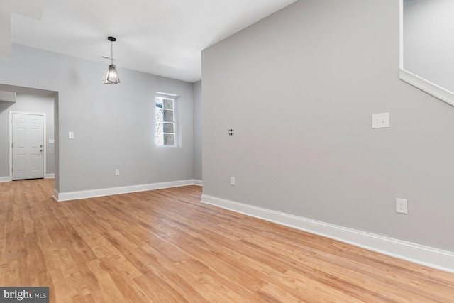 unfurnished room featuring light wood-type flooring