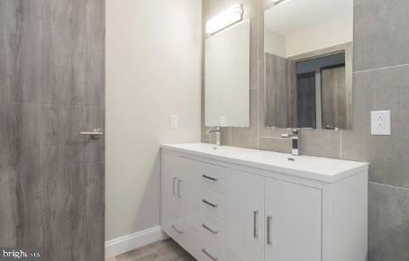 bathroom with hardwood / wood-style flooring and vanity