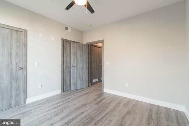 unfurnished bedroom with light hardwood / wood-style floors and ceiling fan