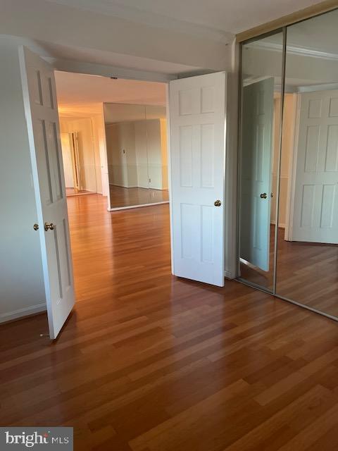 hall featuring wood finished floors