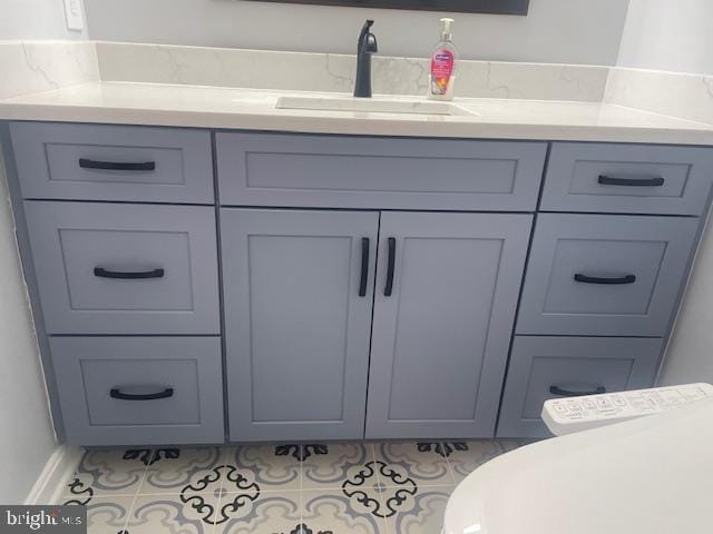 bathroom with vanity and tile patterned floors