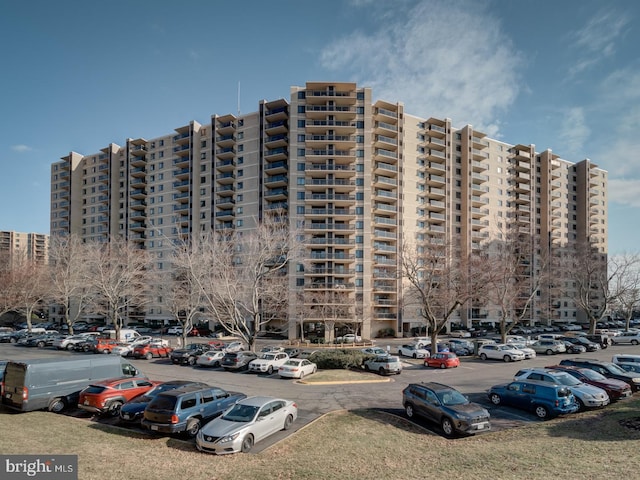 view of property with uncovered parking