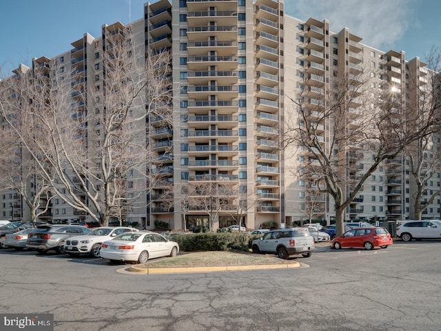 view of property featuring uncovered parking