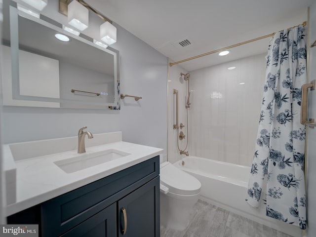 bathroom featuring shower / tub combo, visible vents, vanity, and toilet