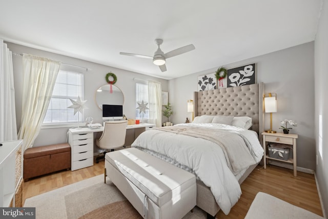 bedroom with light wood-type flooring and ceiling fan