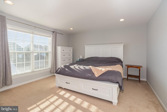 bedroom featuring light colored carpet