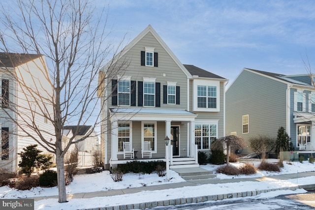 view of front property featuring covered porch