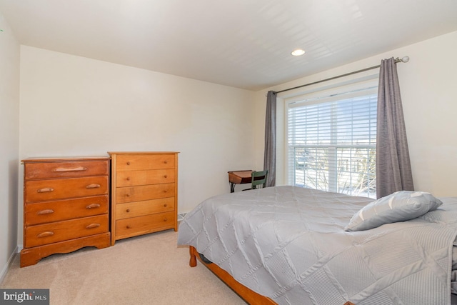 bedroom with light carpet