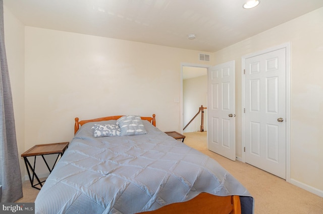 bedroom with light carpet