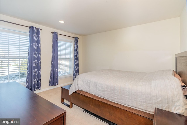 bedroom with light colored carpet