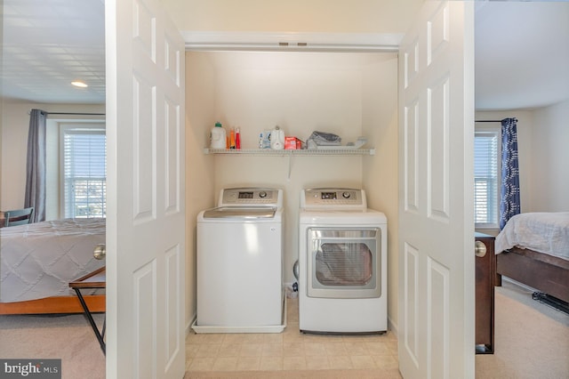 laundry area with separate washer and dryer