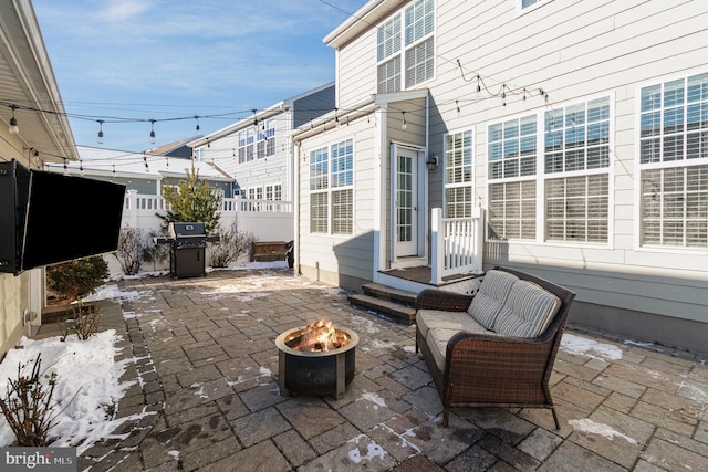 view of patio / terrace with area for grilling and an outdoor fire pit