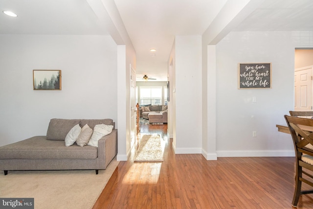 interior space with ceiling fan and hardwood / wood-style floors