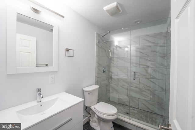 bathroom with vanity, toilet, and walk in shower