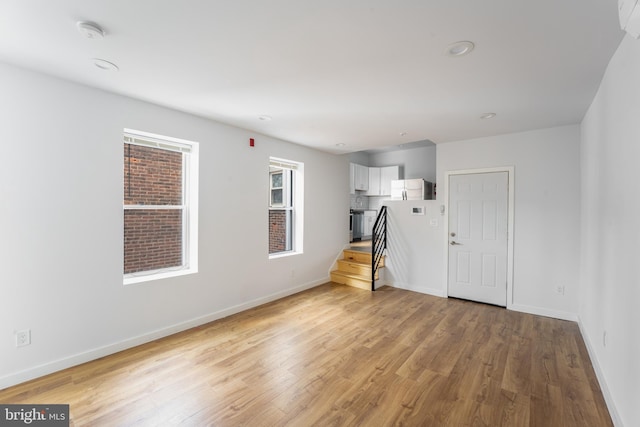 unfurnished room featuring light wood-type flooring