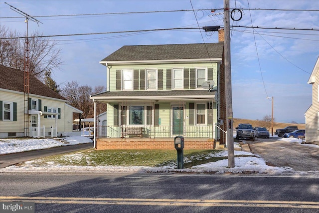 view of front of home featuring covered porch