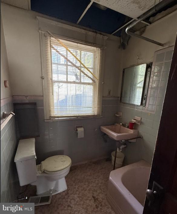 bathroom with toilet and sink