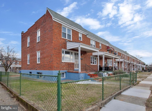 view of property exterior featuring a lawn