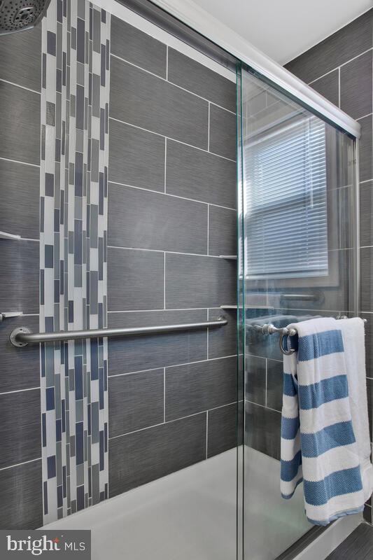 bathroom with an enclosed shower