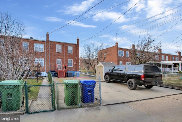 view of side of property with central air condition unit