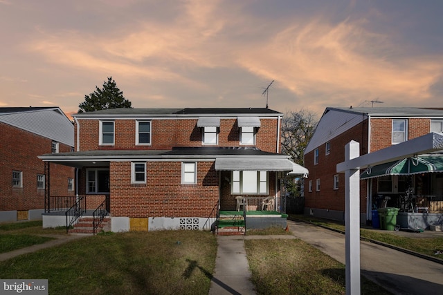 view of front of home with a lawn