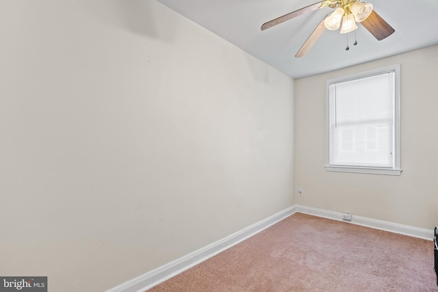 unfurnished room featuring ceiling fan and light colored carpet