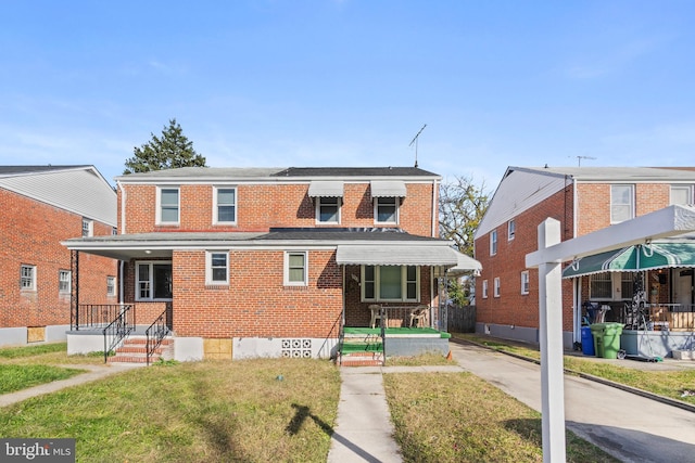 view of front of home featuring a front yard