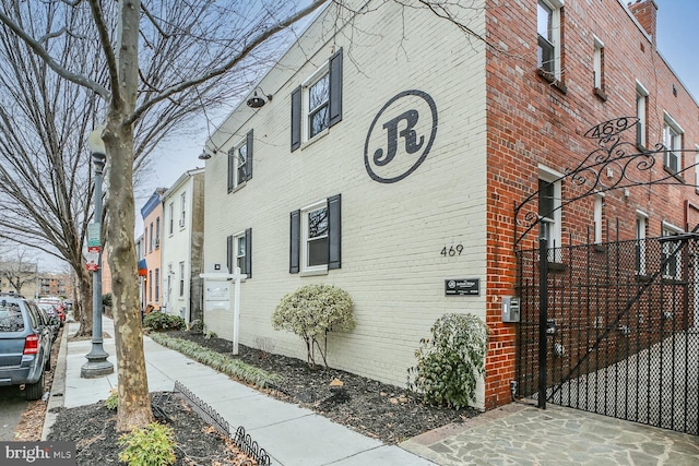 view of property exterior with brick siding