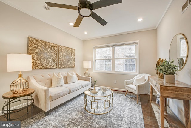 living area featuring baseboards, visible vents, dark wood finished floors, crown molding, and recessed lighting