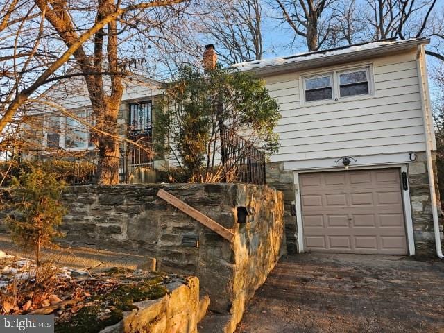 view of home's exterior featuring a garage