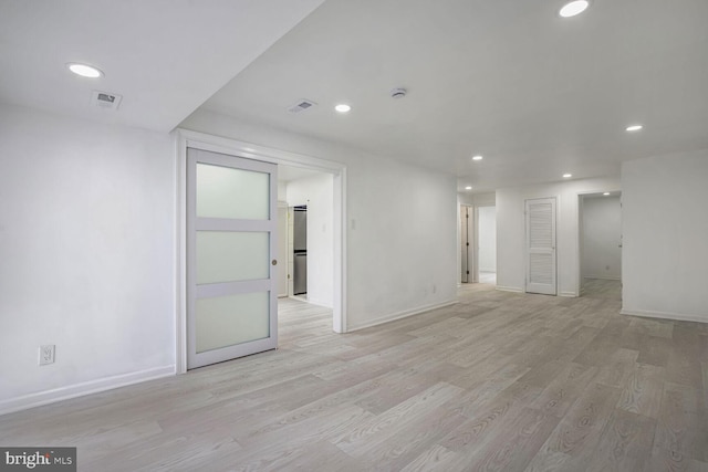 unfurnished room with light hardwood / wood-style flooring