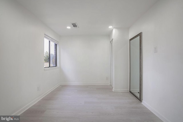 spare room with light wood-type flooring