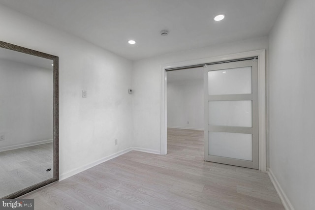 unfurnished bedroom featuring light hardwood / wood-style floors