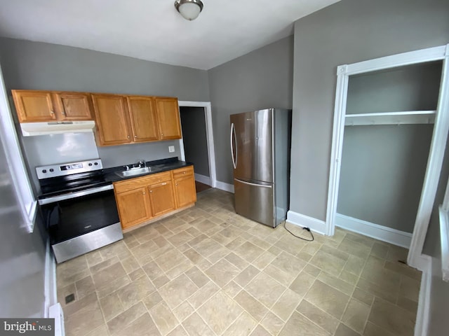 kitchen featuring range with electric stovetop, stainless steel refrigerator with ice dispenser, sink, and stainless steel refrigerator