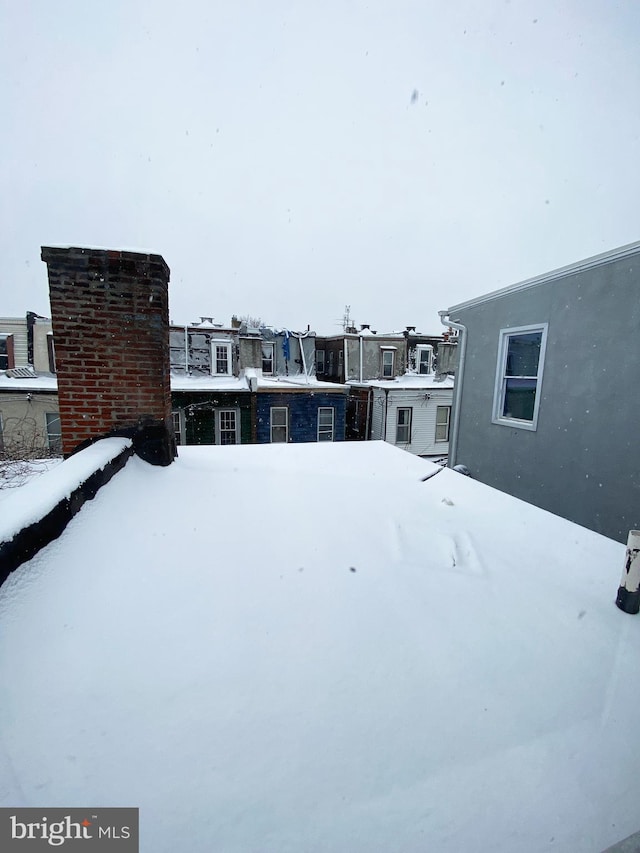 view of yard layered in snow