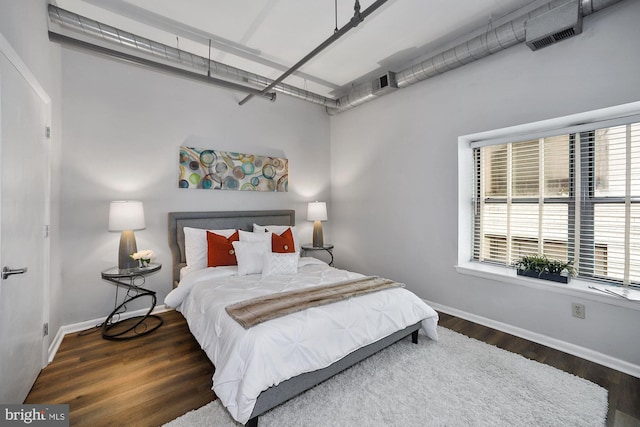 bedroom featuring dark hardwood / wood-style floors