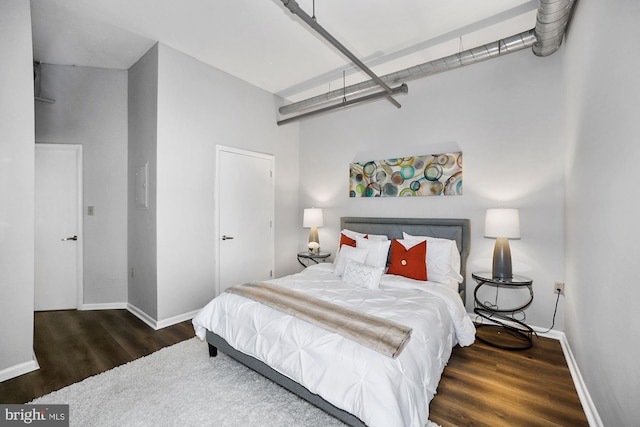 bedroom featuring dark wood-type flooring