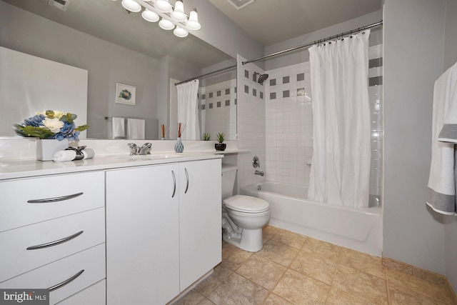 full bathroom with vanity, shower / bath combo, and toilet