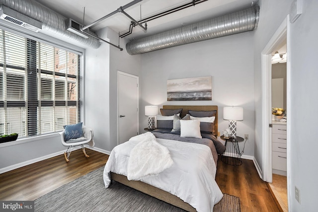 bedroom with hardwood / wood-style floors