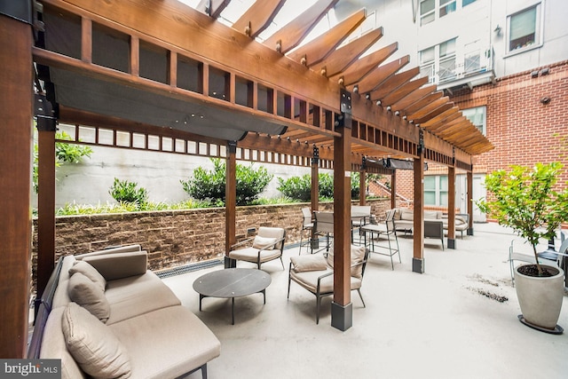 view of patio with an outdoor living space and a pergola