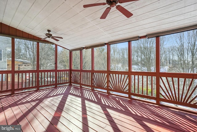 unfurnished sunroom featuring ceiling fan, a healthy amount of sunlight, wooden ceiling, and lofted ceiling