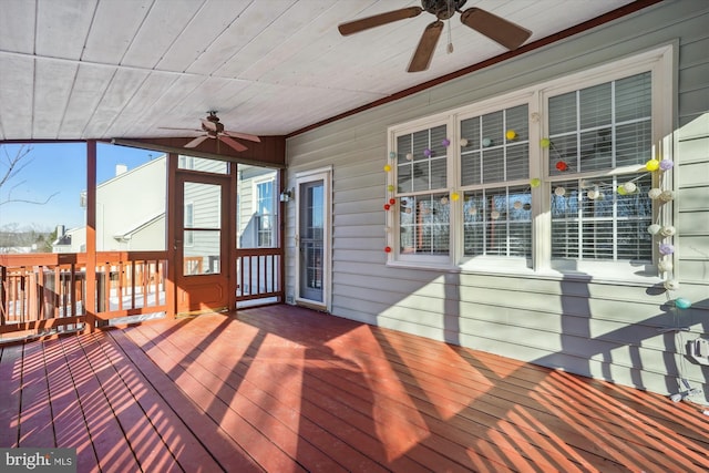 wooden terrace featuring ceiling fan