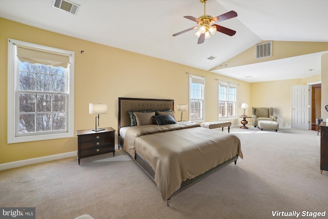 carpeted bedroom featuring ceiling fan and vaulted ceiling