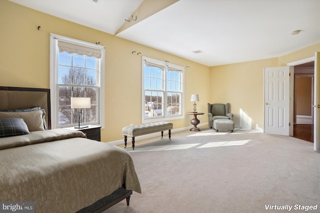 carpeted bedroom featuring vaulted ceiling