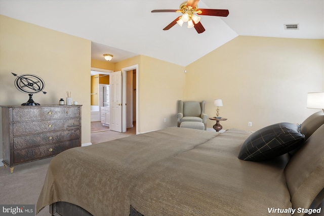 carpeted bedroom with ceiling fan, lofted ceiling, and connected bathroom