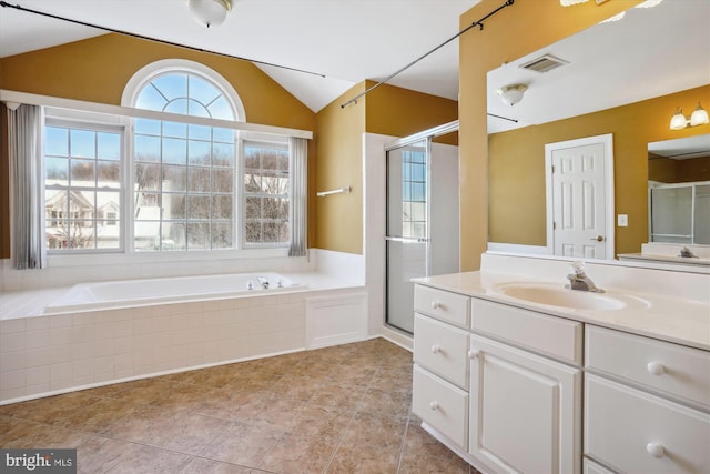 bathroom featuring vanity, separate shower and tub, and lofted ceiling