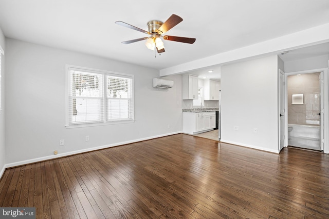 unfurnished living room featuring sink, ceiling fan, dark hardwood / wood-style floors, and a wall unit AC